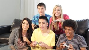 Young adults playing a video game together